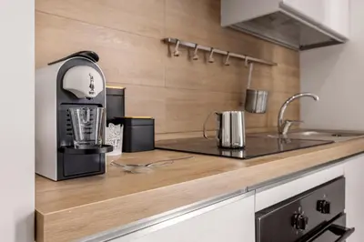 a kitchen with a coffee maker on a counter at Dream Holidays - Apartments in Palermo