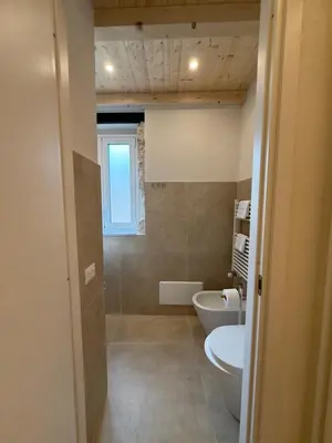 a bathroom with a toilet and a sink at La Piccola Formica in Palermo