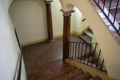 an overhead view of a winding staircase with wooden floors at Dimora Ballarò in Palermo