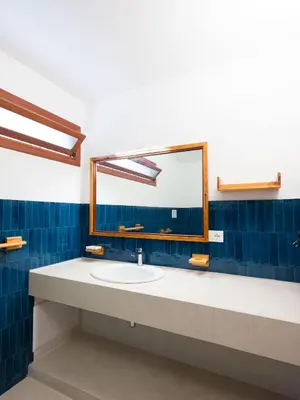 a bathroom with a sink and a mirror at Villa Hybiscus con piscina in Castellammare del Golfo