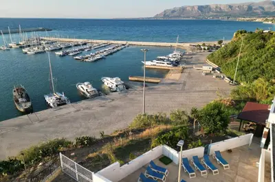 a marina with a bunch of boats in the water at Baia Marina Oasi in Balestrate