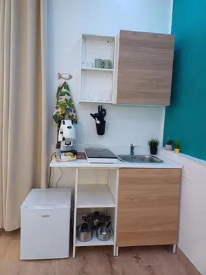 a small kitchen with a desk and a sink at Carruzzata 2 in Bagheria