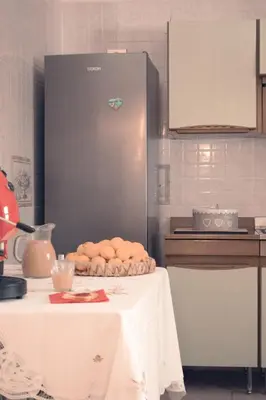 a kitchen with a table with a pile of food at Casa del Gelso Tra Palermo e Cefalù in Trabia