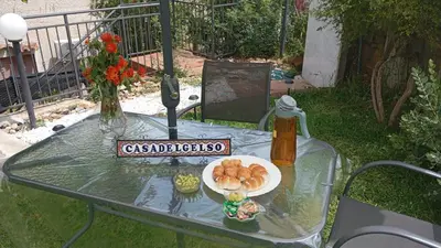 a glass table with a plate of food on it at Casa del Gelso Tra Palermo e Cefalù in Trabia