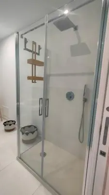 a shower with a glass door in a bathroom at utveggio view apartment in Palermo