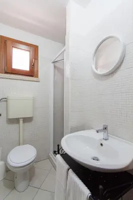 a shower with a glass door in a bathroom at Antico Casale Siciliano in Balata di Baida