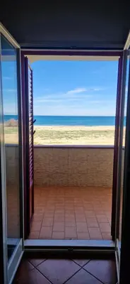 a room with a view of the ocean from a window at Arancina Abbronzata in Balestrate