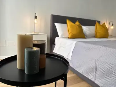 a room with a bed and a table with a bed at Casa Calucca Barrilaio in Palermo