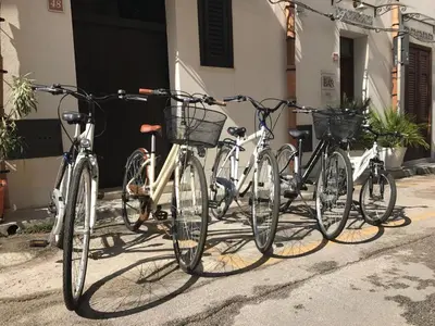 a group of bikes parked next to a building at TAM Vacanze B&B in Cinisi