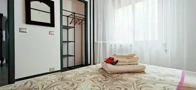 a bedroom with a bed with a pile of towels at Gioia Guesthouse in Alcamo