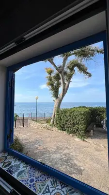 a window view of the ocean from a house at Casa Sulla Spiaggia Villa Eléftheria in Altavilla Milicia