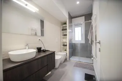 a bathroom with a sink and a toilet and a shower at Casa Pisani 274 in Palermo