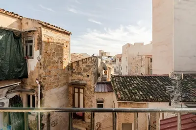a view from the balcony of an old building at GuestHost - Hamuri Holiday House - Heart of Palermo in Palermo