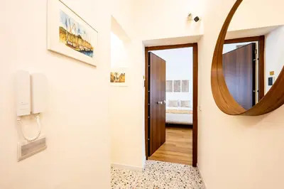 a hallway with a mirror on the wall at Appartamenti Pellegrino Centro in Palermo