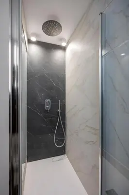 a bathroom with a shower with a glass door at Casa Palermo in Palermo