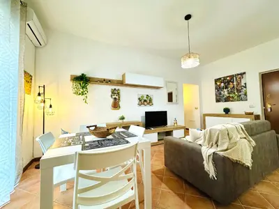 a living room with a couch and a table at Il Moro Suite in Palermo
