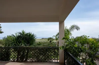 a balcony with a view of the ocean at Casa Lucido di fronte la Tonnara in San Vito lo Capo