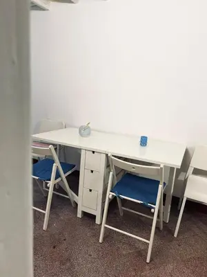 a desk with two chairs and a white desk with a keyboard at B&B Al Porto Home in Palermo