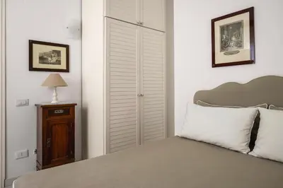 a bedroom with a bed and a closet at Villa Angela By DomuSicily in Capaci
