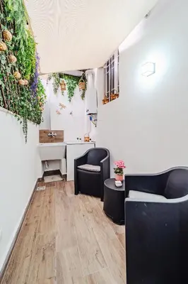 a living room with two chairs and a desk at N'amuri in Palermo