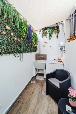 a room with a desk and a chair and plants at N'amuri in Palermo