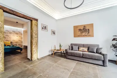 a living room with a couch and a table at N'amuri in Palermo