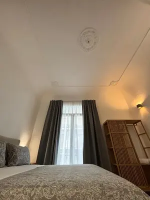 a bedroom with a bed and a window at Historic Palazzo - Apartments & Rooms with Private Bathroom in Palermo