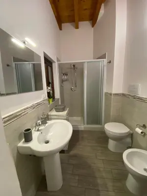 a bathroom with a sink and a toilet and a shower at White House Theater Massimo in Palermo