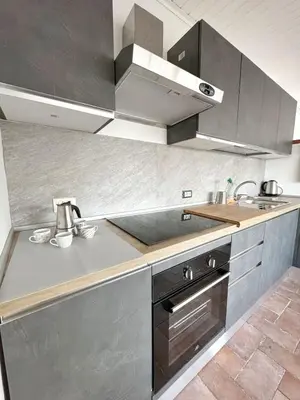 a kitchen with stainless steel cabinets and a sink at Casa Ragonese in Palermo