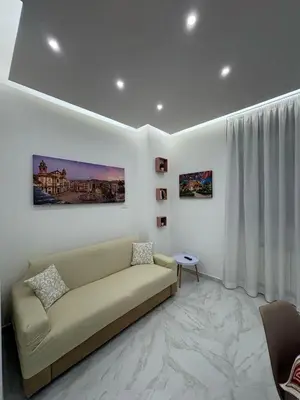 a living room with a couch and a table at A Casa di Giro suite apartment in Palermo