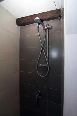 a shower with a shower head in a bathroom at Casa Vacanza Isola di Eufemio in Capaci