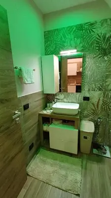 a bathroom with a sink and a mirror at Sogni D'oro 01 in Partinico