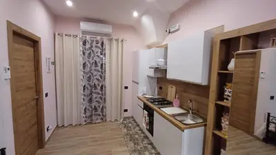 a small kitchen with a sink and a stove at Sogni D'oro 01 in Partinico