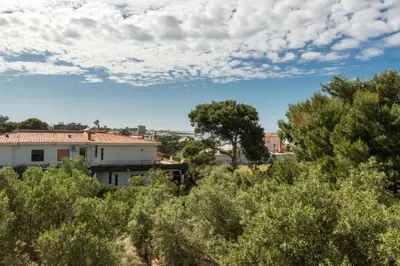 a view of a house from the trees at Villa Emma 50 mt from the sea with private pool in Carini