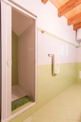 a shower with a glass door in a bathroom at Casa vacanze Giusi in Castellammare del Golfo