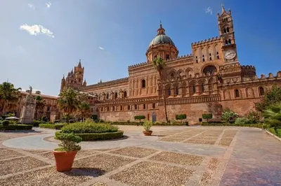 a large building with a clock tower on top of it at Casa Vacanza Isola di Eufemio Piano Terra in Capaci