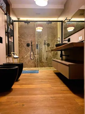 a bathroom with two sinks and a shower at Gira e Firria in Palermo