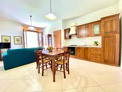 a kitchen and dining room with a table and chairs at Residence Piana, San Vito Lo Capo in San Vito lo Capo