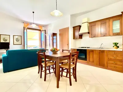 a bedroom with a bed and a lamp on a table at Residence Piana, San Vito Lo Capo in San Vito lo Capo