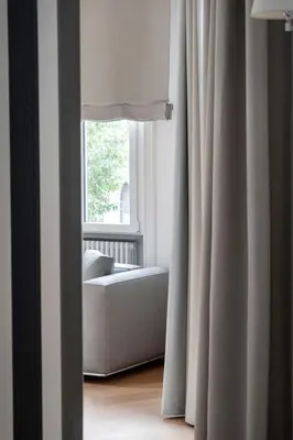 a living room with a couch and a window at G Cave 125 Boutique Apartment in Palermo