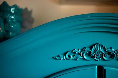 a blue cabinet with a piece of art on it at Vela House charming front of sea in Palermo