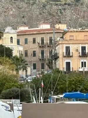 a large building in front of a building at La Casa di Alan in Palermo