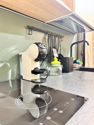 a kitchen counter with a hair dryer on the counter at Plaza Suite in Palermo