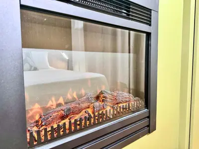 a fireplace with some food inside of it at Plaza Suite in Palermo