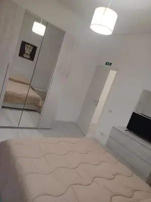 a room with two mirrors and a bed in it at La casa di gabry in Palermo
