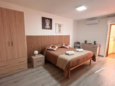a bedroom with a bed with two pillows on it at Dimora del Moro alla Cattedrale in Palermo
