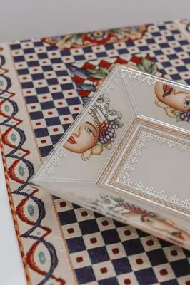 two cards on a table with a chess board at Dimora del Moro alla Cattedrale in Palermo