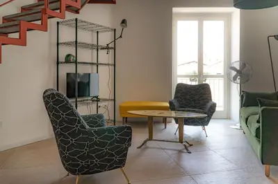 a living room with chairs and a table at Summaq Terrace in Palermo