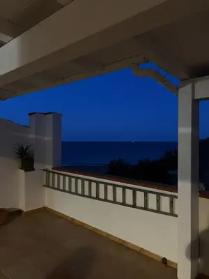 a view of the ocean from the balcony of a house at La Terrazza del Mare in Palermo