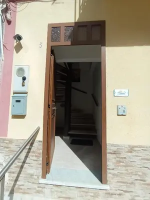 an open door of a building with a staircase at La Terrazza del Mare in Palermo